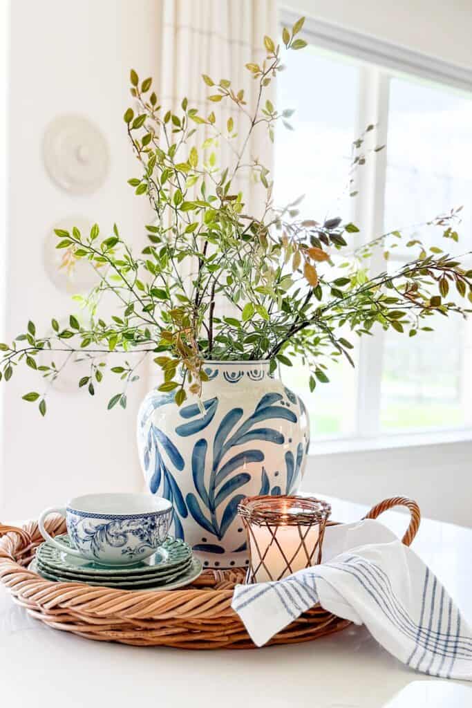 a blue and white vignette on a kitchen island