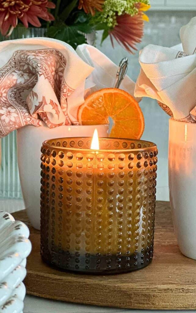 amber-hobnail-candle-with-dried-orange-slice-on-fall-coffee-bar.jpg