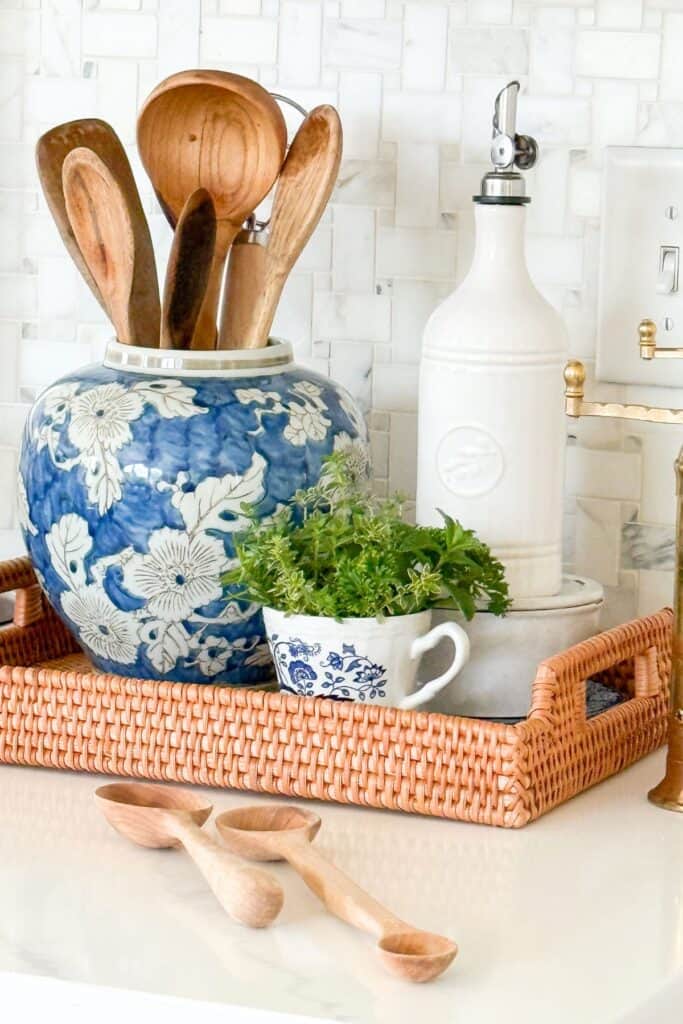a basket holding kitchen essentials next to a stove