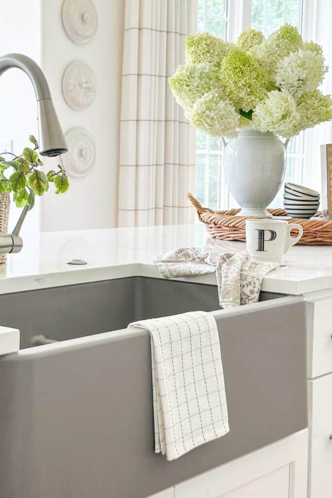 kitchen towel on the side of a sink