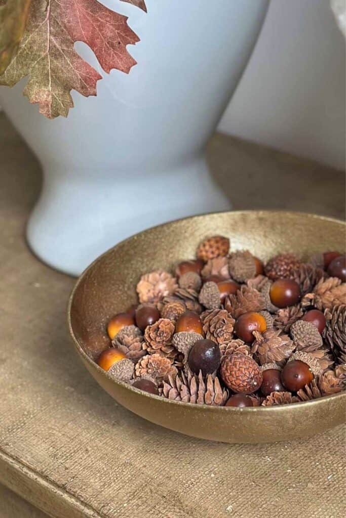 gold bowl with acorns and mini pinecones