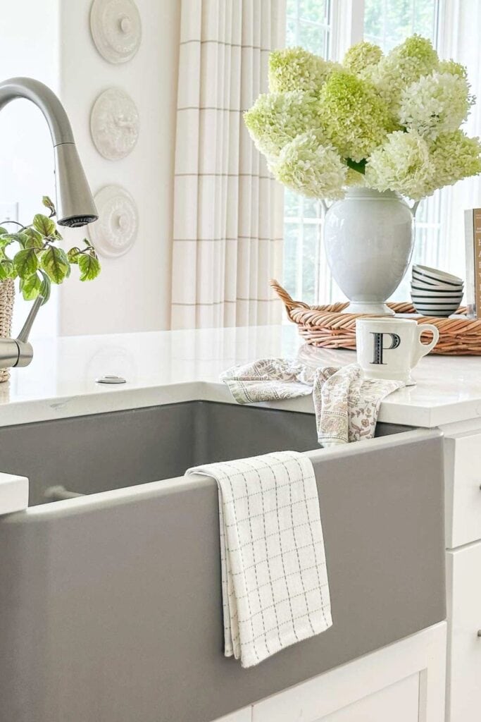 neutral kitchen with hydrangeas and soft decor showing how to decorate with undertones and color