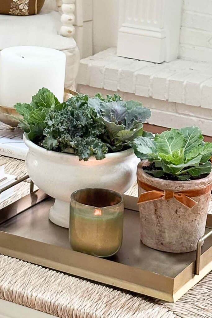 vintage crocks on a gold tray