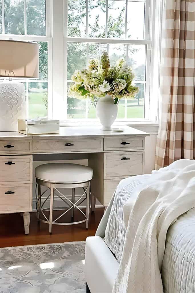white hydrangeas in a vase on a bedroom vanity styled for fall
