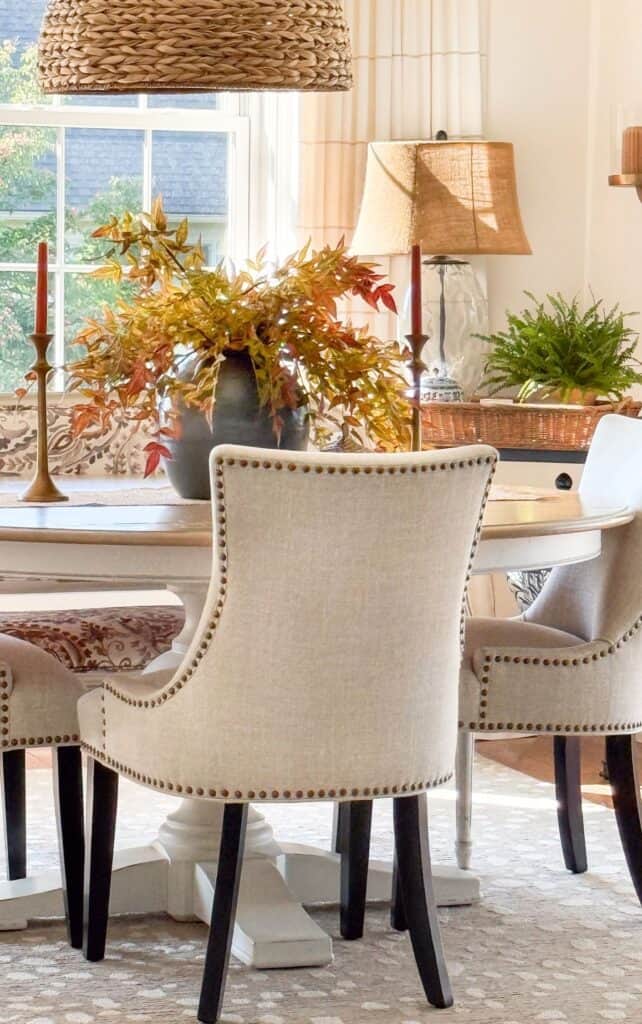 beautiful brilliant fall leaf arrangement on the dining room table