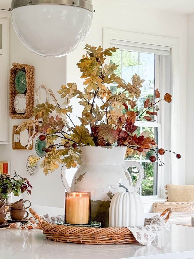 vignette with urn filled with all leaves and pods