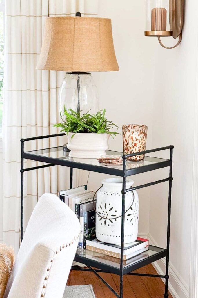 lamp on a bar cart in a dining room
