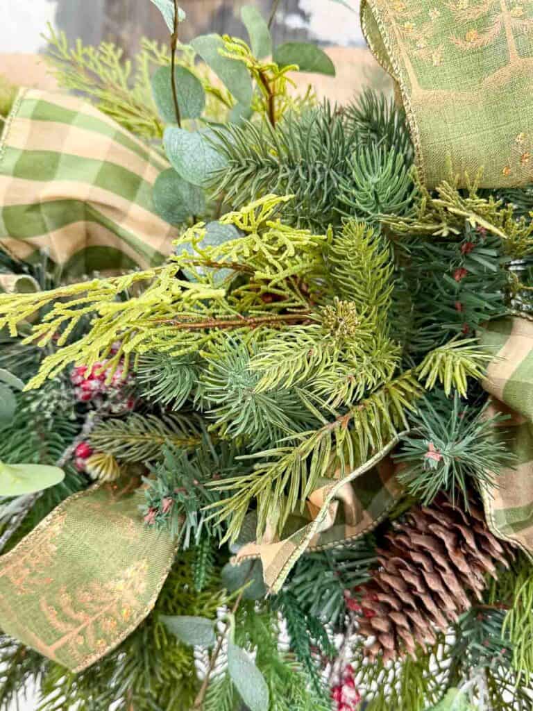 various greens stuck into the garland