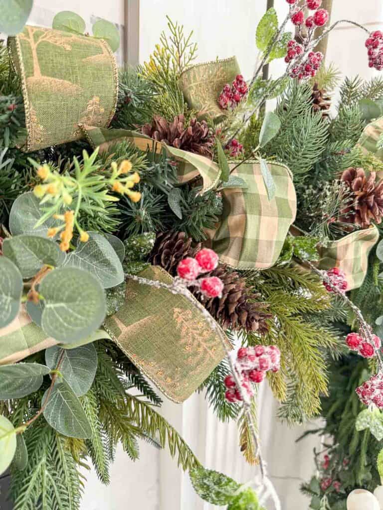 loops of ribbon on a brambly Christmas garland