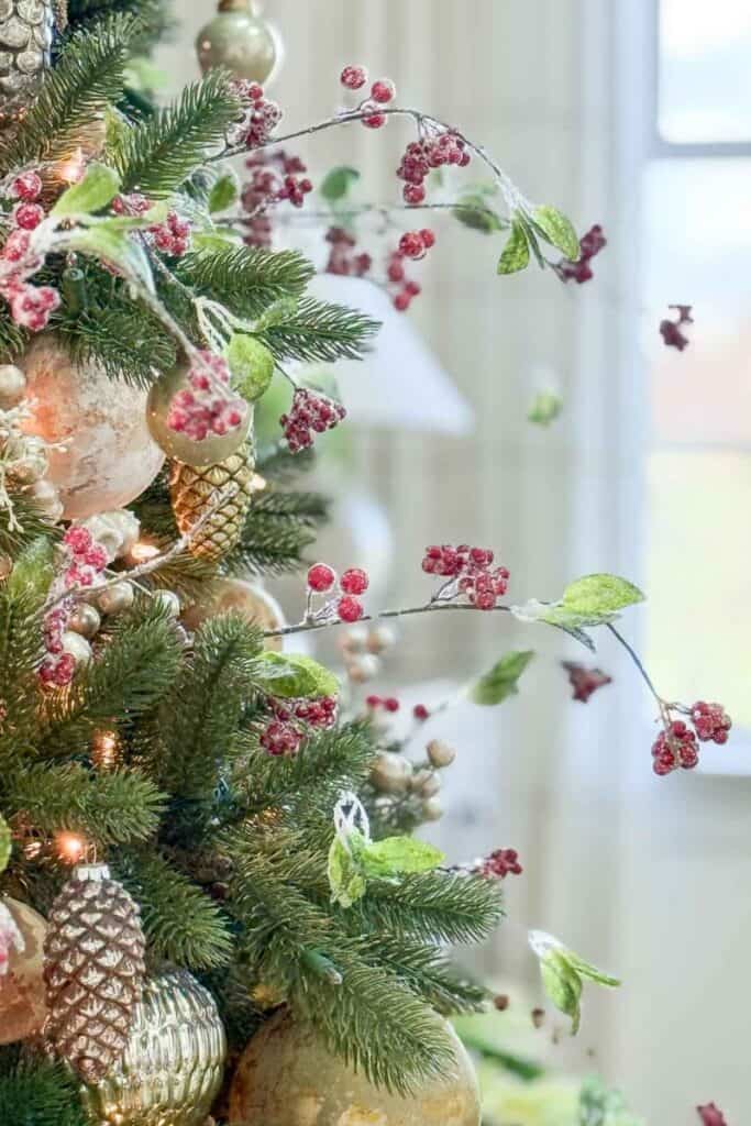 red berries on a green Christmas tree