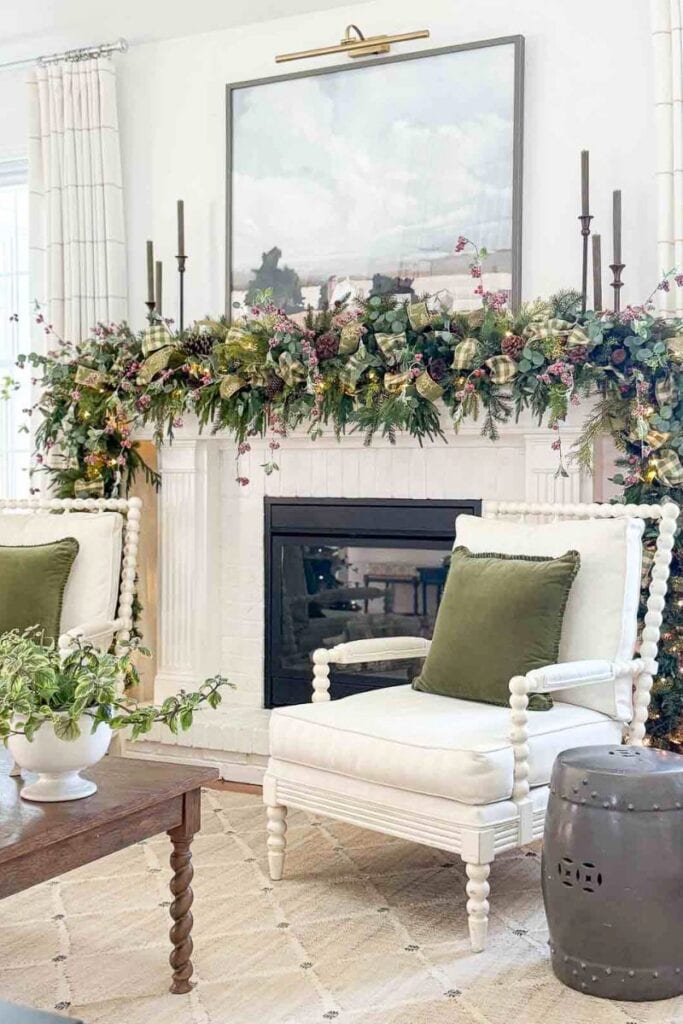 Candles in various candleholders on a mantel