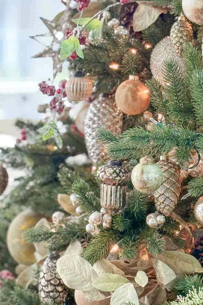 a collection of ornaments on a decorated Christmas tree