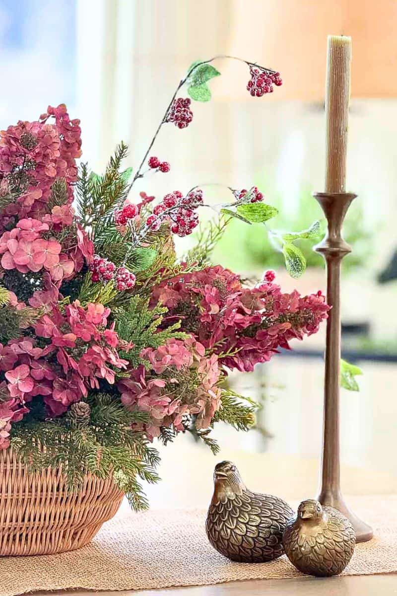 basket of red hydrangeas on a dining room table