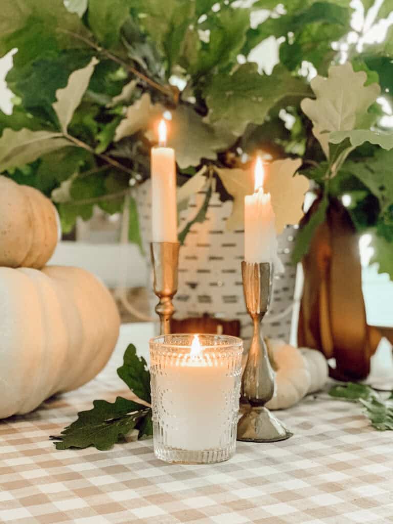 candles and pumpkin on a table