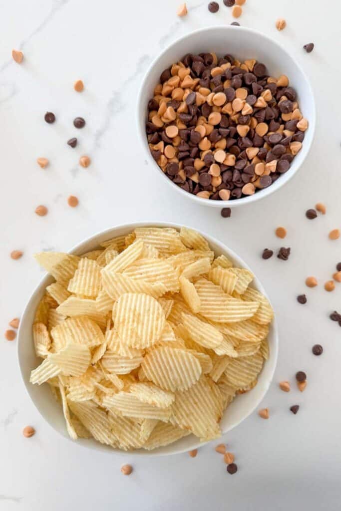 Ingredients for no bake haystack cookies with ridged potato chips and milk chocolate and butterscotch chips