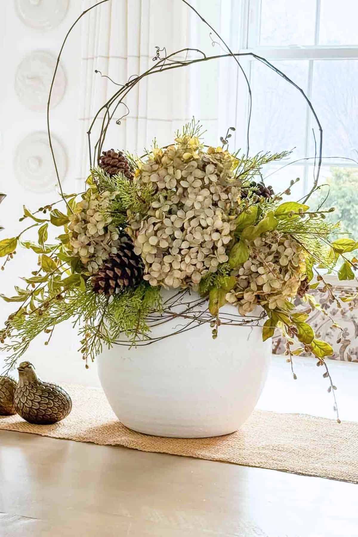 winter hydrangea arrangement on the dining room table