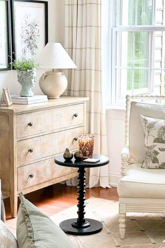 living room chest, chair, and drink table that is lived-in