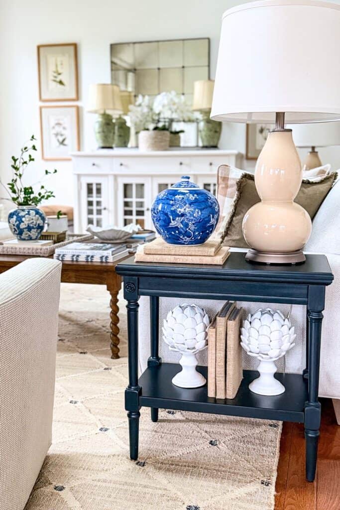 Coffee table tray styled with vase, greenery, candle, and books.