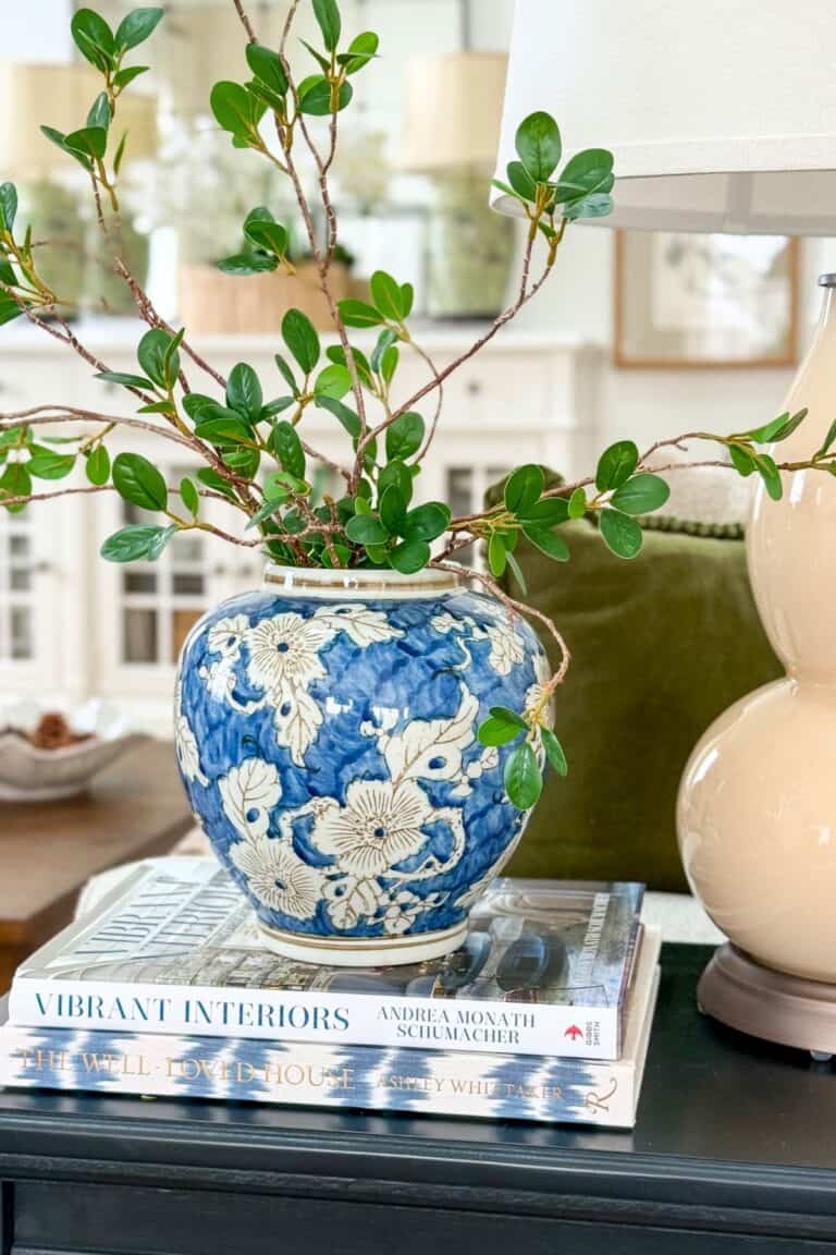 blue and white ginger jar filled with faux greens