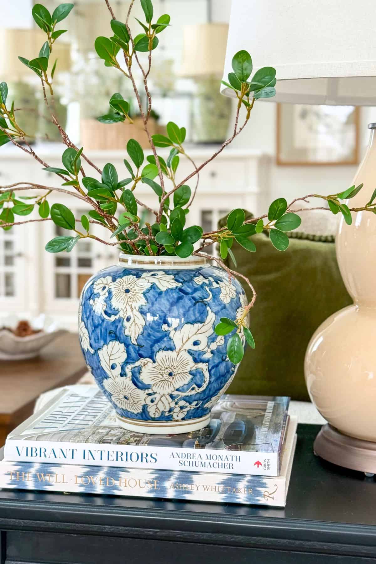 blue and white ginger jar filled with faux greens