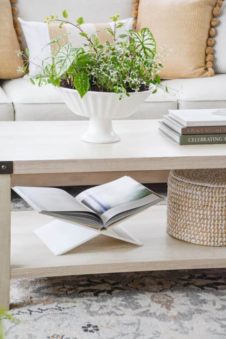 Neutral living room coffee table styled with fewer decorative items for a cleaner, more balanced look.