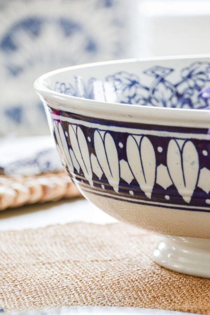 Blue and white ceramic bowl styled on a woven placemat, adding a fresh and simple winter detail to a February home