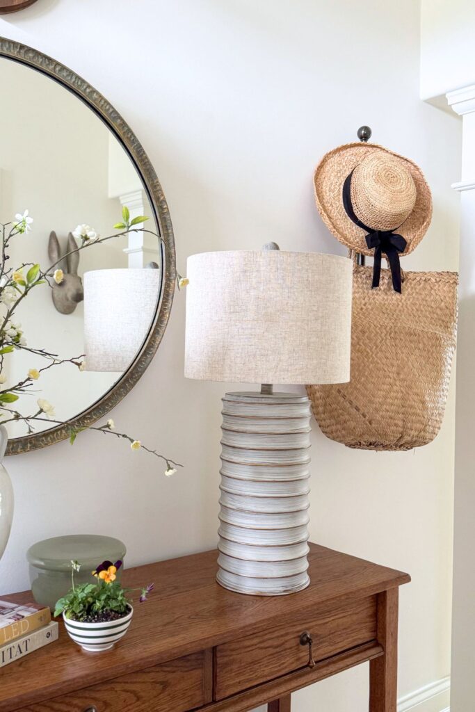 hat and basket hanging in the foyer