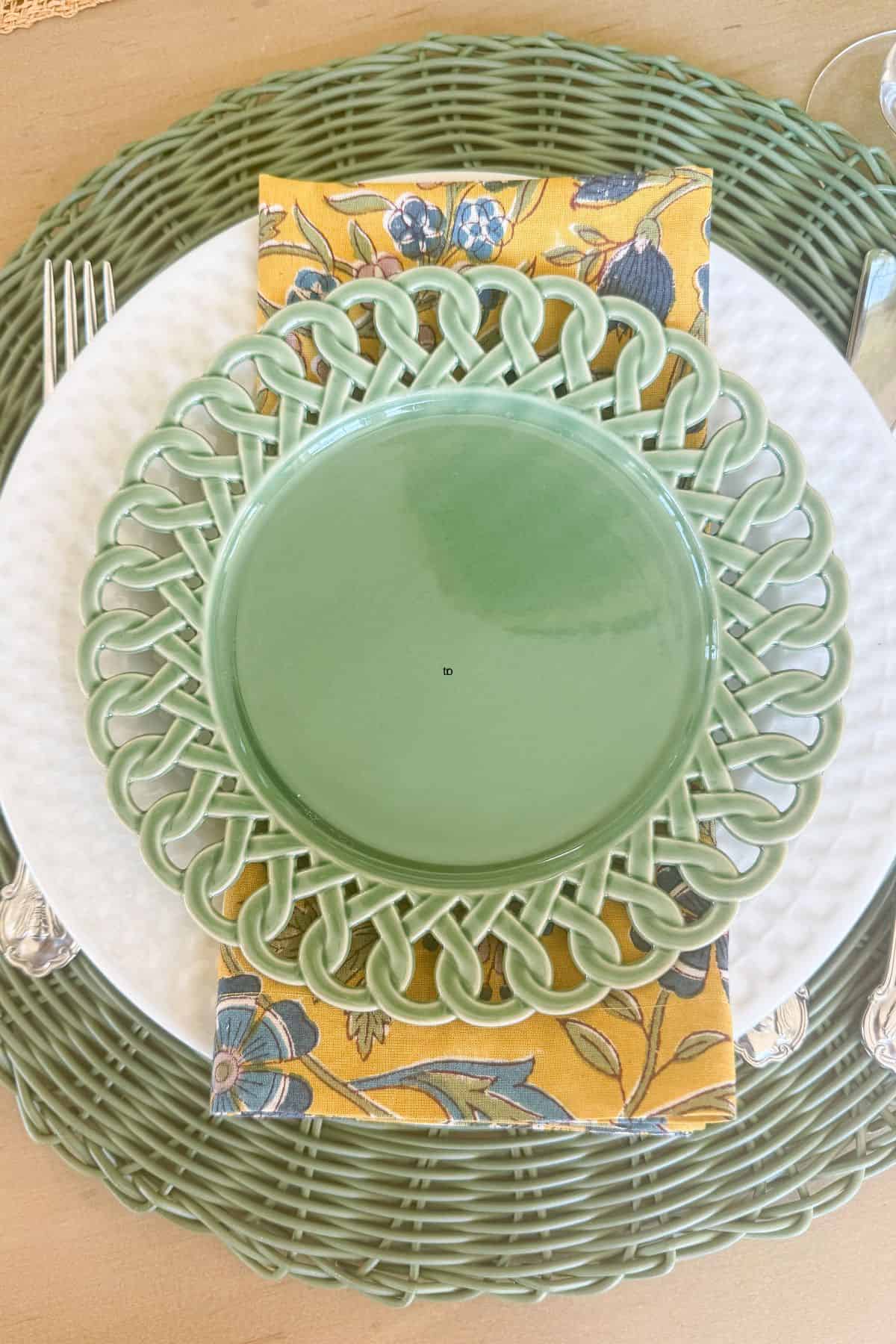 green and yellow place setting on a table