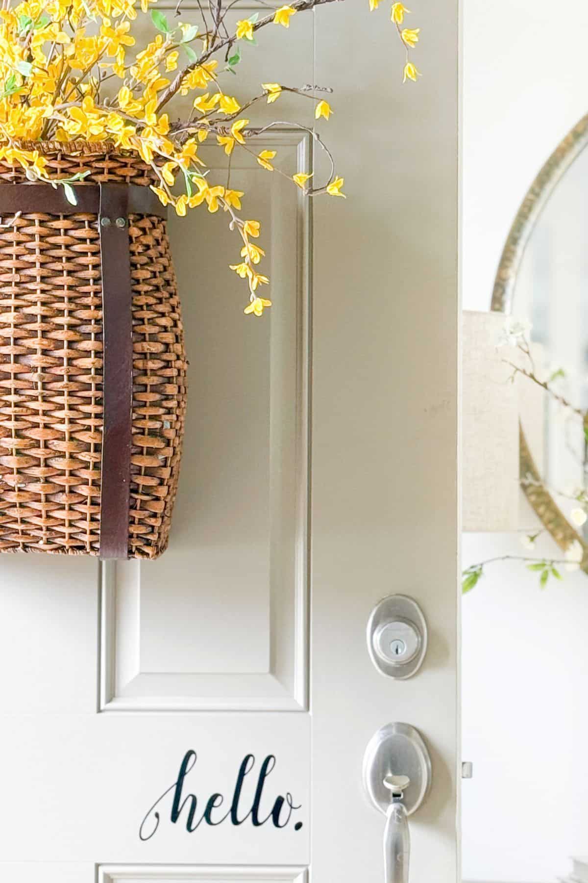 basket of forsythia on the front door