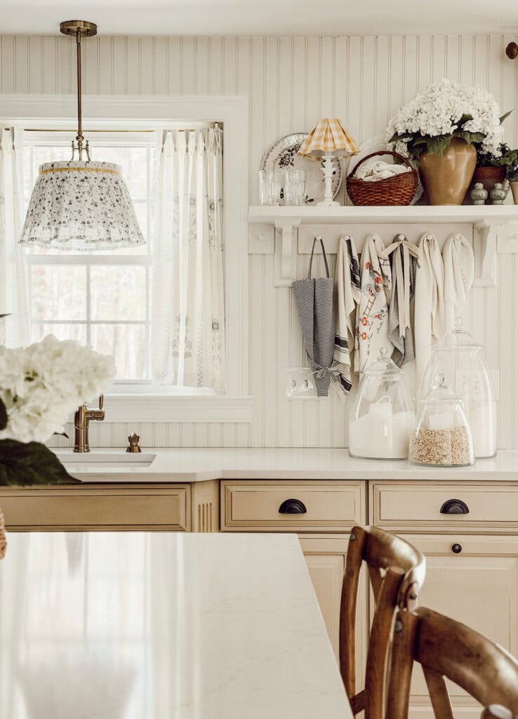 neutral colored kitchen with a pendant light
