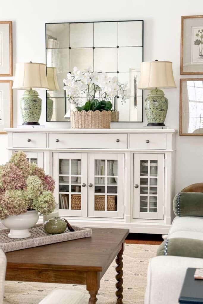 living room with a white buffet and a turned leg wooden coffee table