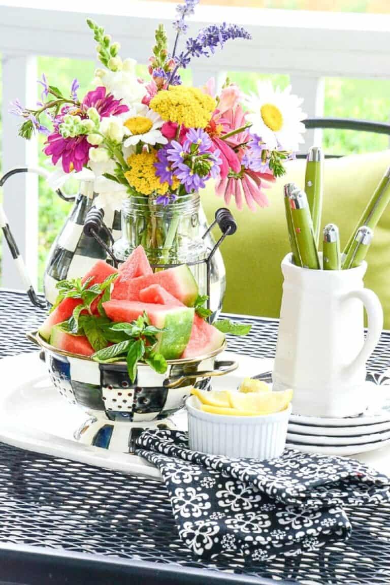 a patio table filled with summer treats