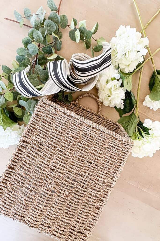 materials used to make a hydrangea summer basket for the front door, with black and white French striped ribbon