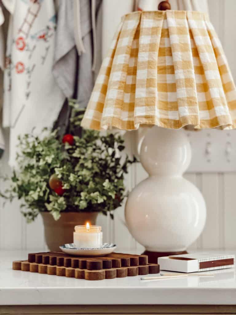 Sweet pleated yellow and white check lampshade on a double round lamp
