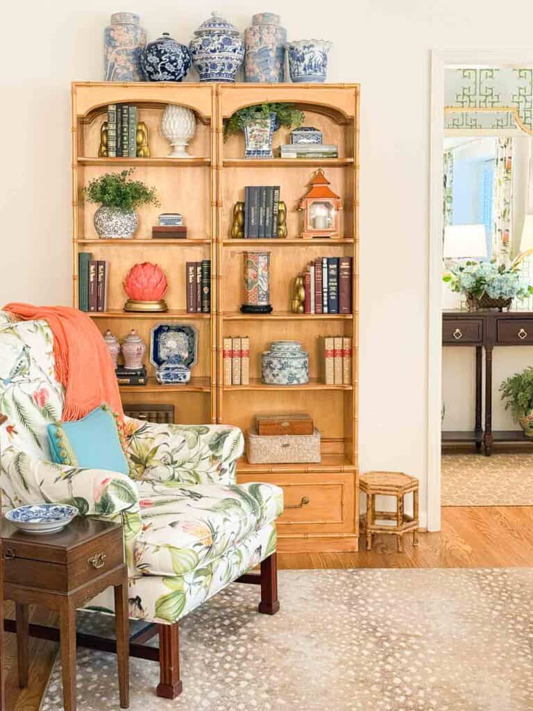 colorful chair in a living room with a bookshelf in the background