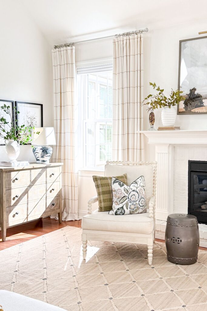 mantel, chair. and a small chest in a living room