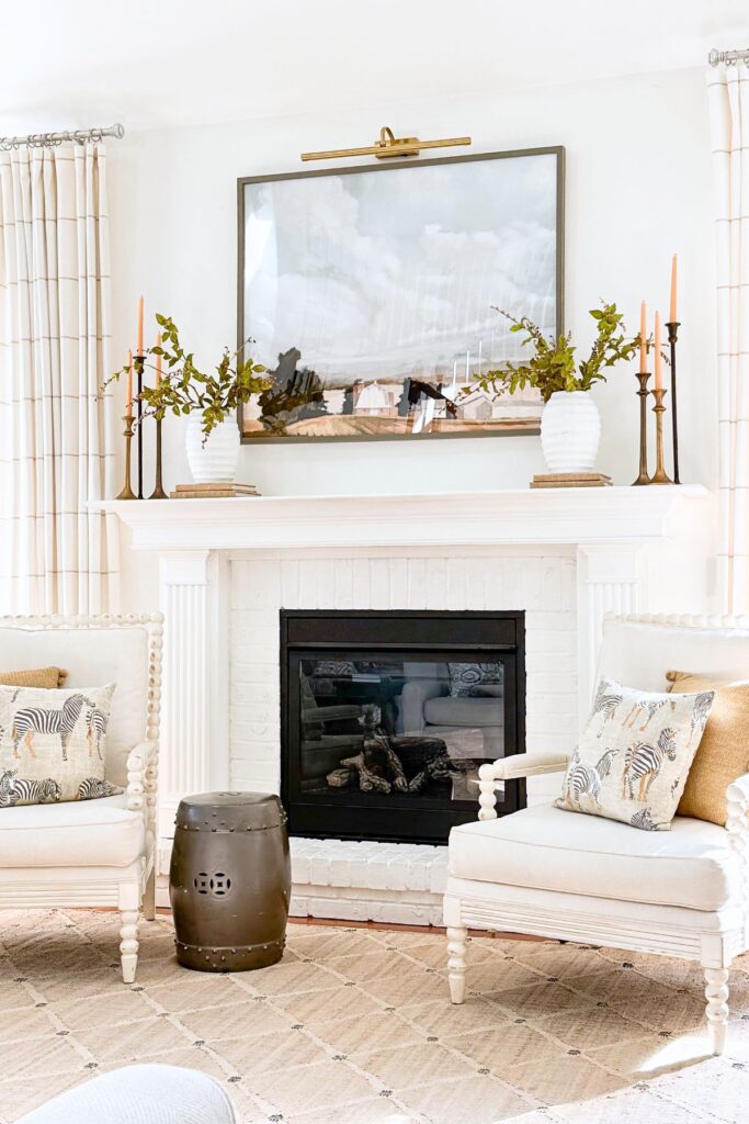 warm camel colored pillows reflect the color story on the mante