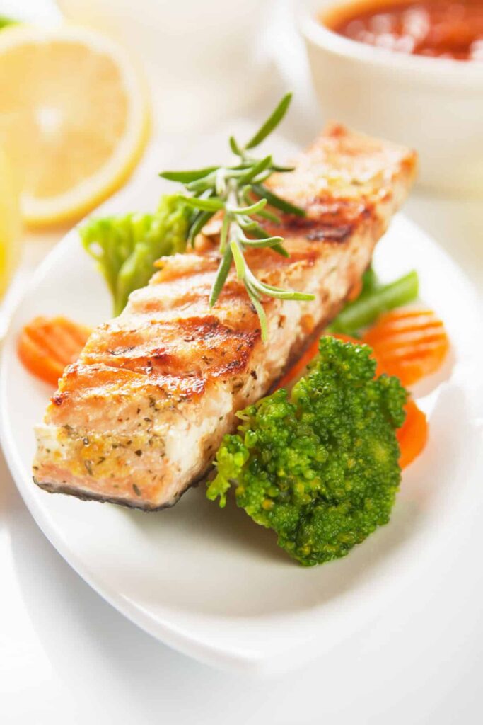 salmon on a plate with mixed vegetables