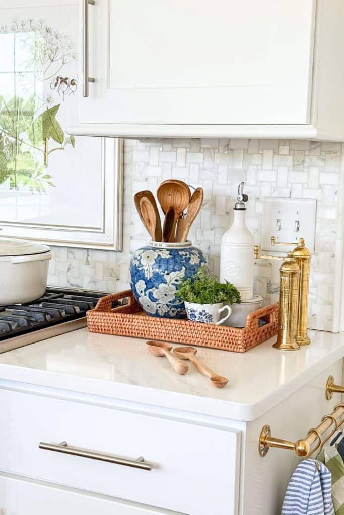 tray holding kitchen items in a white kitchen
