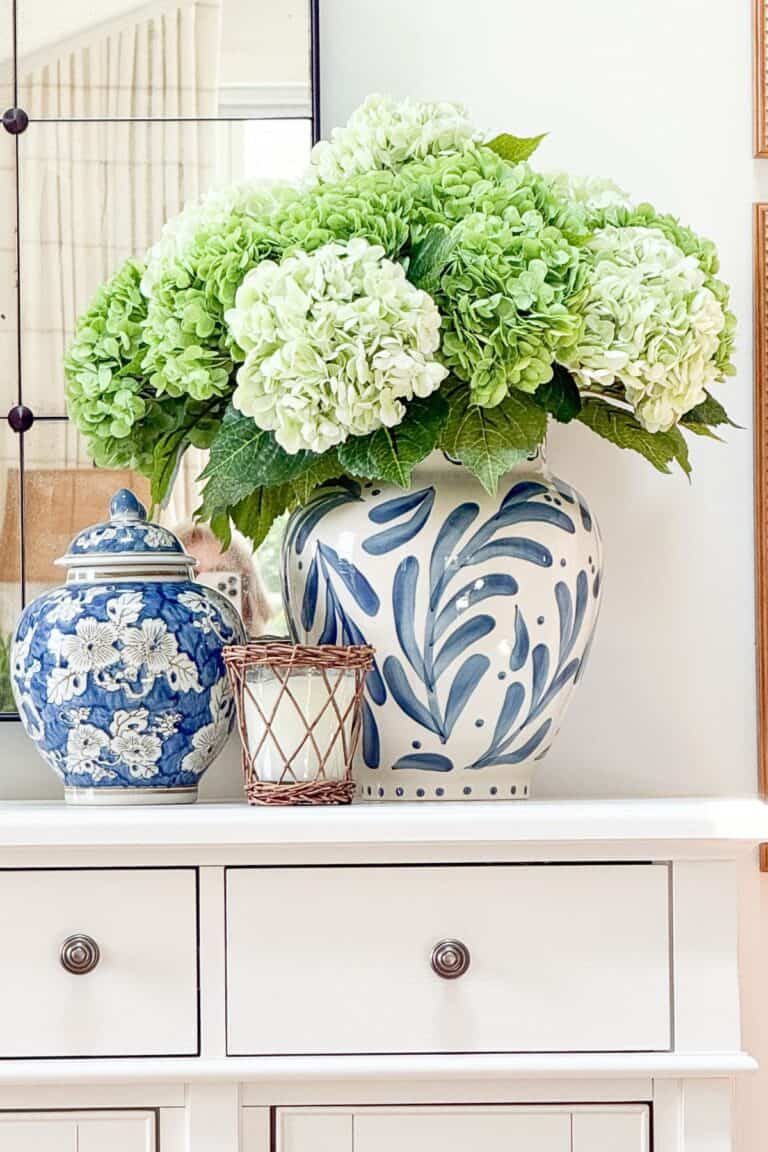 Trio of blue and white decor on a white buffet