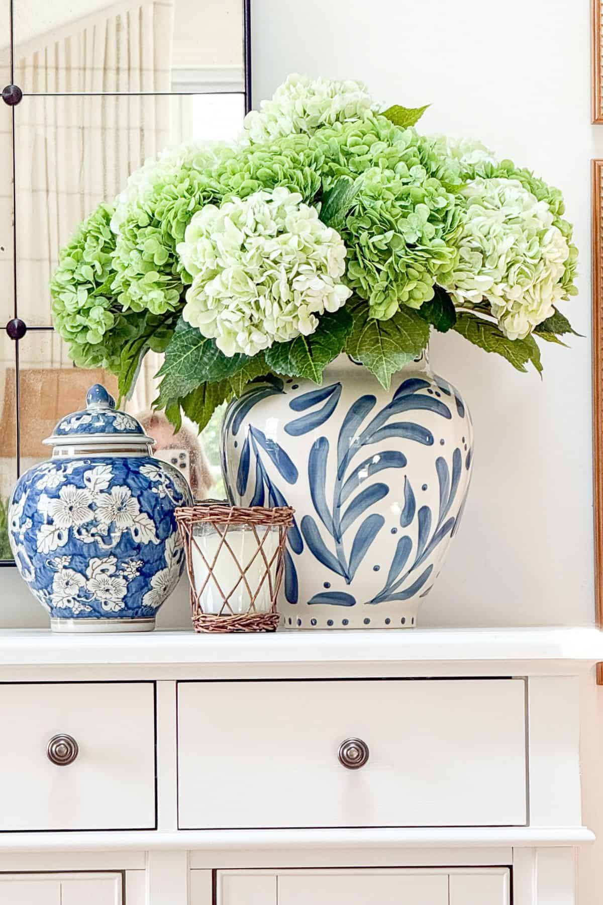 Trio of blue and white decor on a white buffet