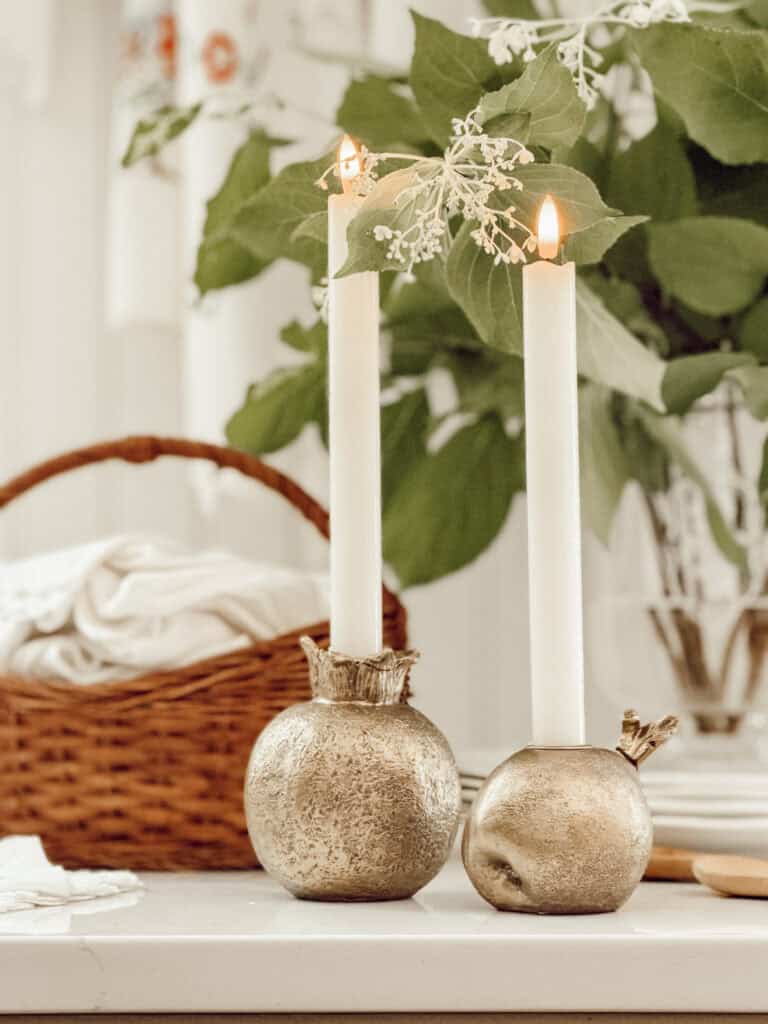 pomegranate candles with white candlesticks