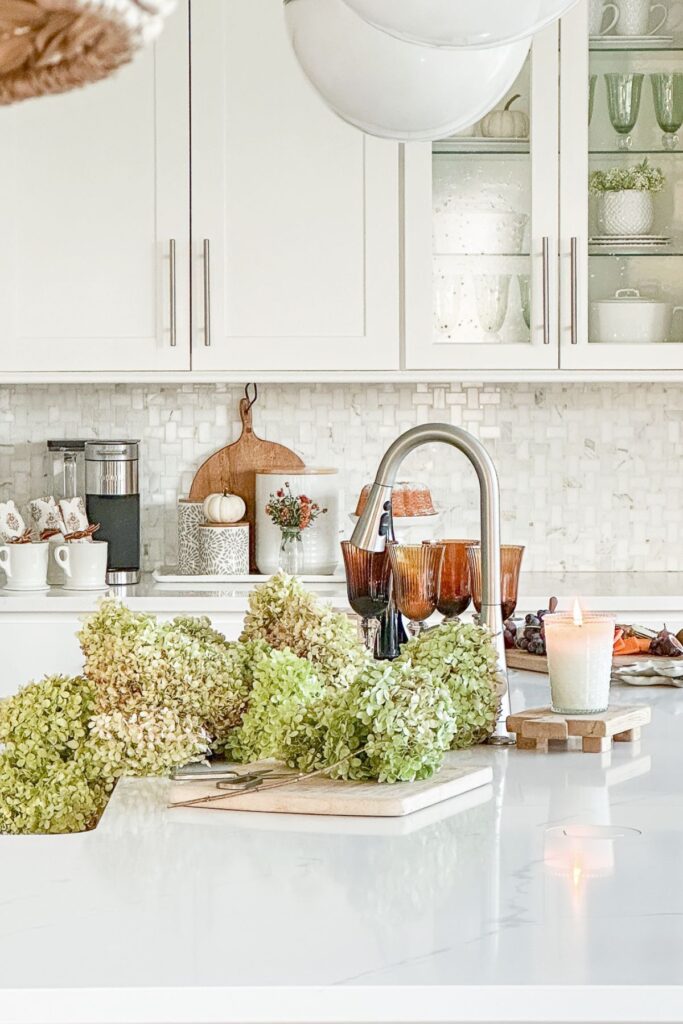 Dried green hydrangeas on kitchen counter with fall styling