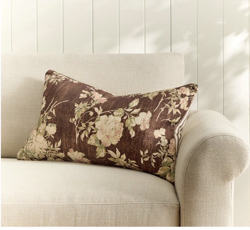 beautiful fall floral pillow with brown background