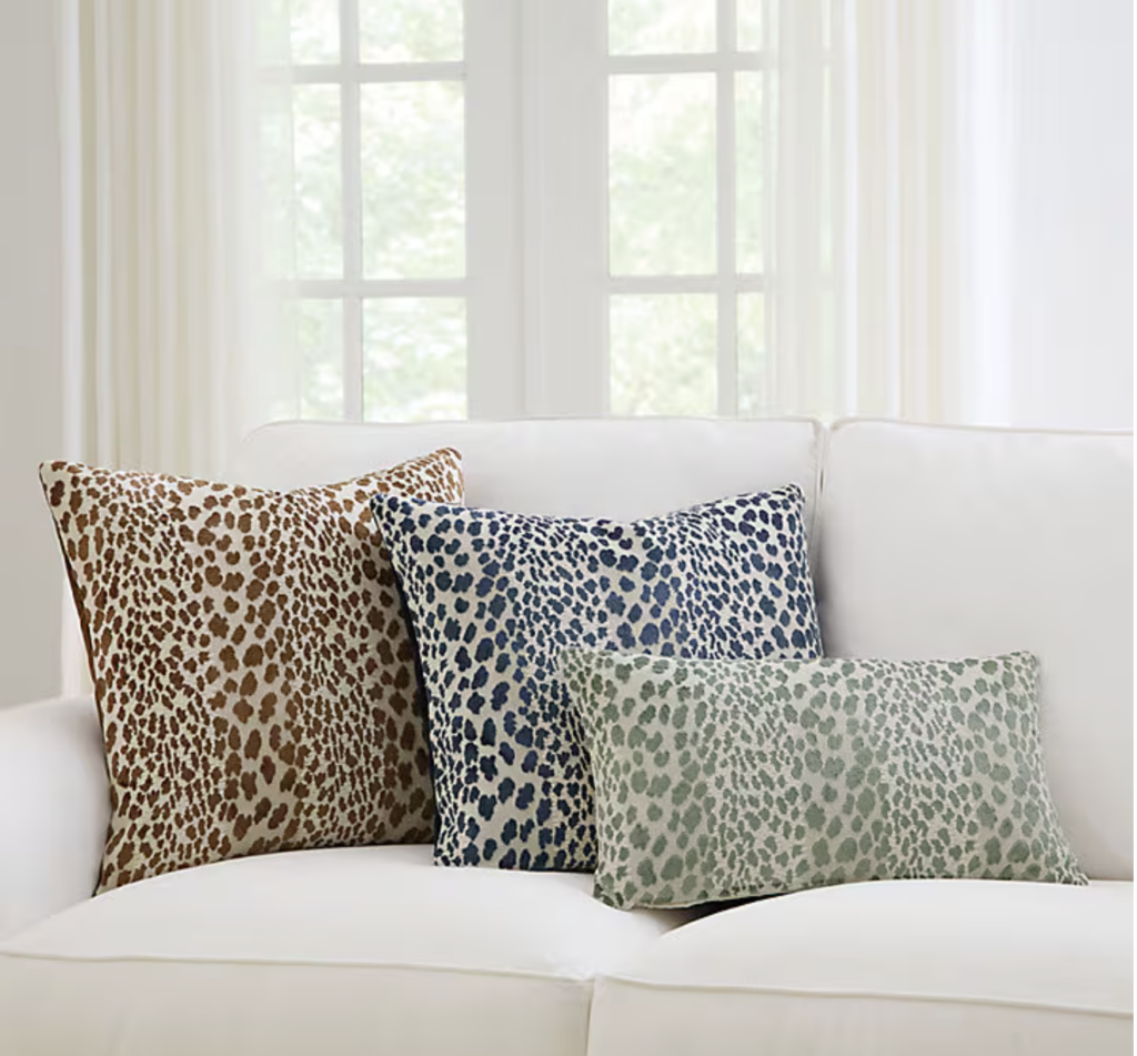 three different animal print pillows