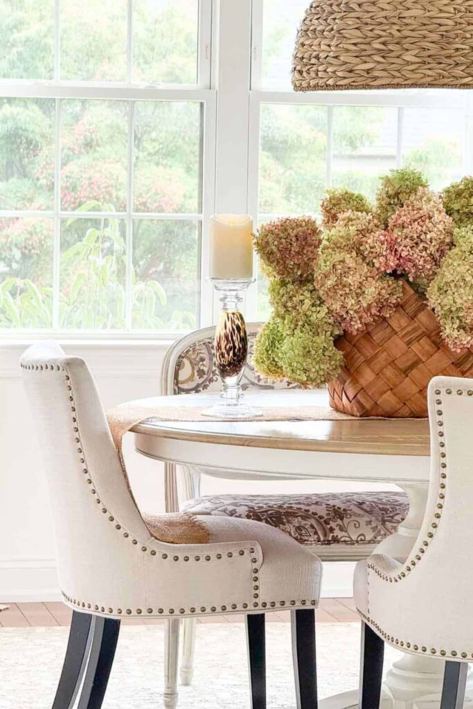 basket of dried hydrangeas on a dining room table