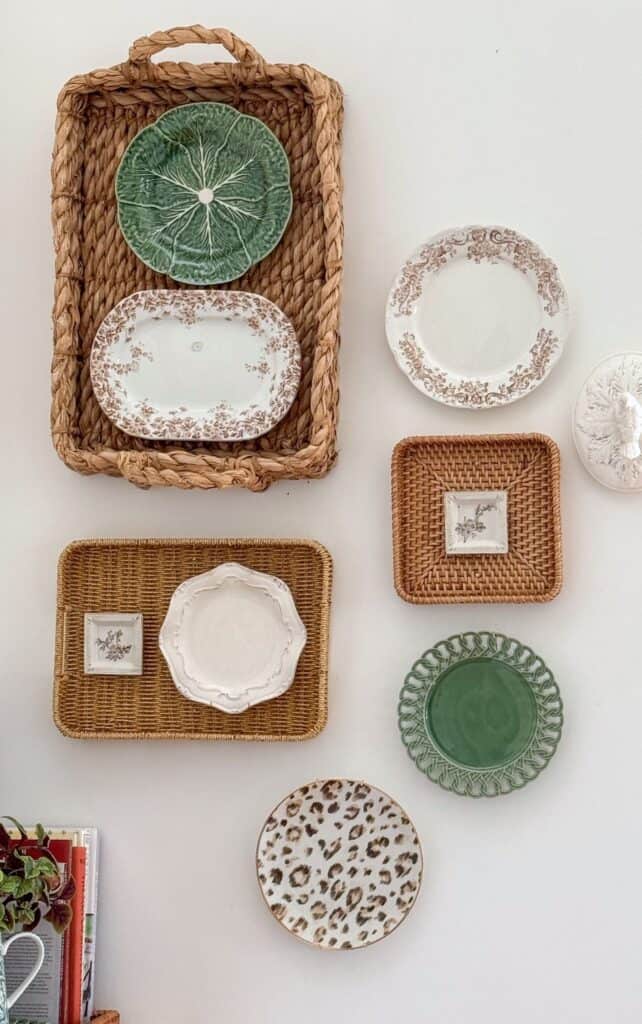 Basket and plate wall decor arranged for visual balance with a mix of textures and patterns