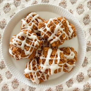 pumpkin spice cookies on a white cake plate