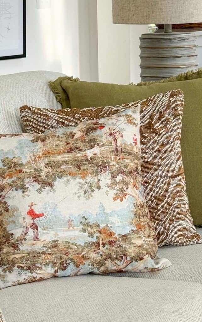 three pillows on a neutral sofa