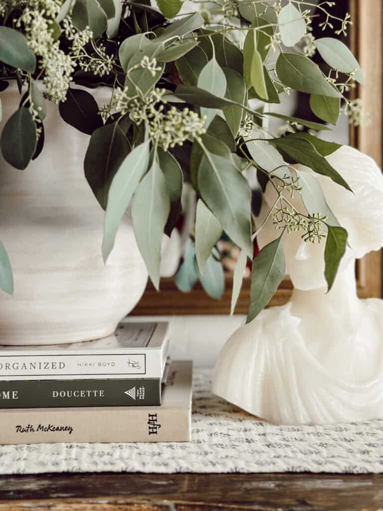 SEEDED EUCALYPTUS IN A WHITE CROCK